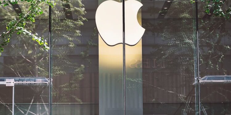 man passing an apple store