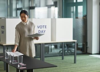 woman putting white paper on the table