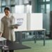 woman putting white paper on the table