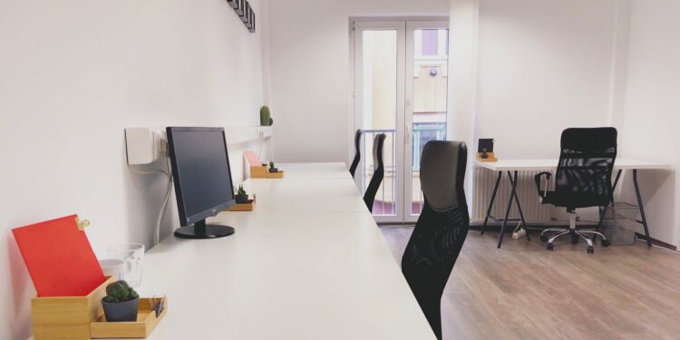 Bright and modern coworking office space in Budapest, showcasing minimalist design and contemporary furniture.