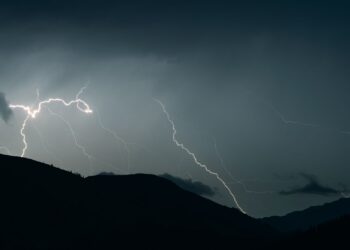 thunderstorm over hills