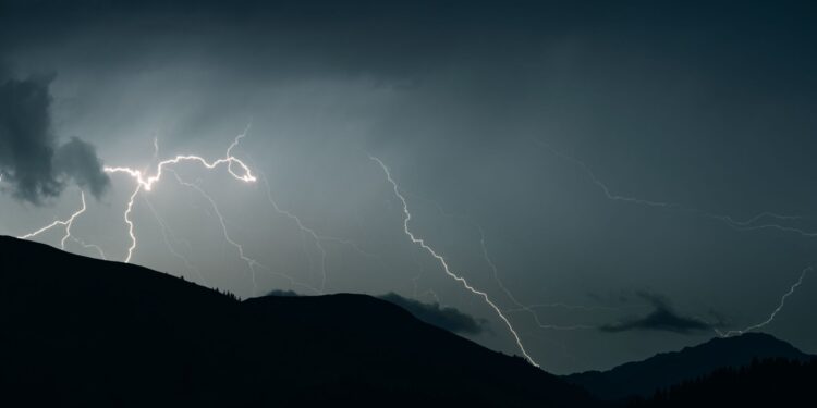thunderstorm over hills