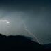 thunderstorm over hills